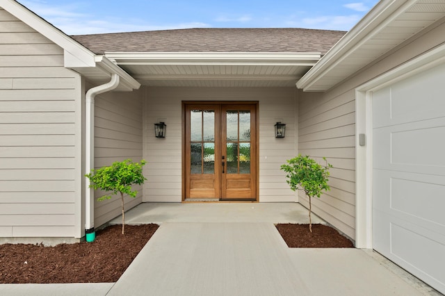 2385 N Traveller Dr, Columbia, MO 65202 - view of exterior entry featuring french doors and a shingled roof