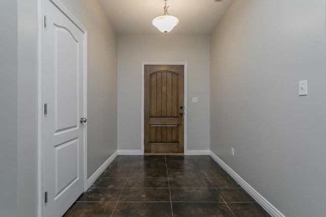 entrance foyer featuring baseboards