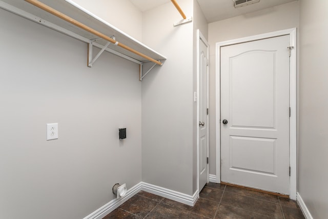 washroom featuring baseboards and electric dryer hookup