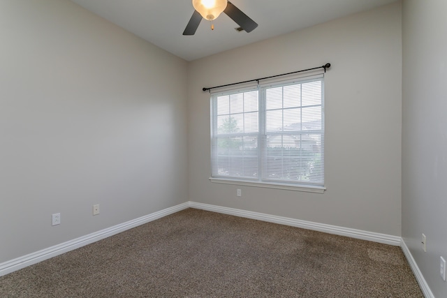 unfurnished room with ceiling fan, carpet floors, and baseboards