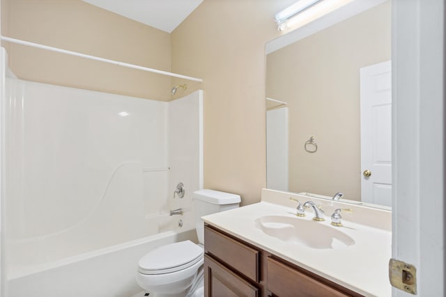 bathroom with toilet, vanity, and shower / washtub combination