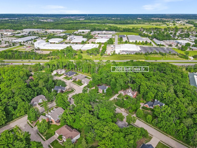 aerial view of property and surrounding area with nearby suburban area and property boundaries highlighted