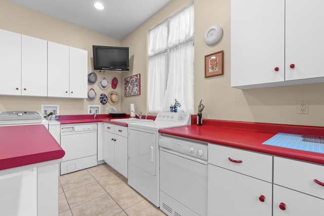 kitchen featuring white dishwasher, washer and dryer, white cabinets, and recessed lighting