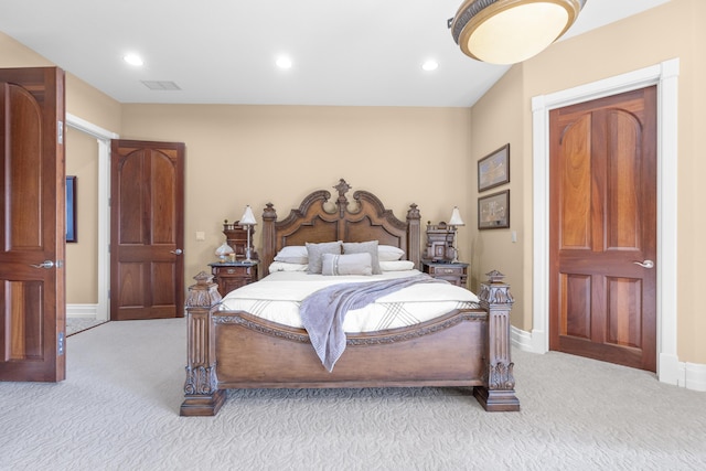 bedroom with light colored carpet, recessed lighting, and baseboards