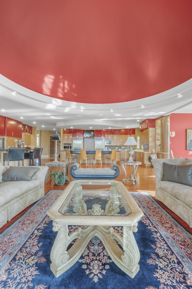 living area featuring wood finished floors and recessed lighting