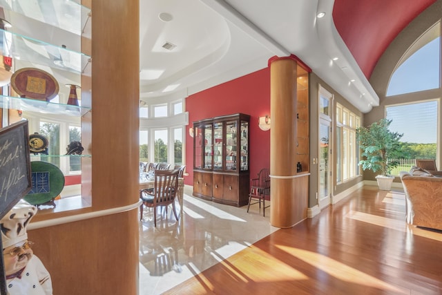 entrance foyer featuring decorative columns, wood finished floors, recessed lighting, and baseboards