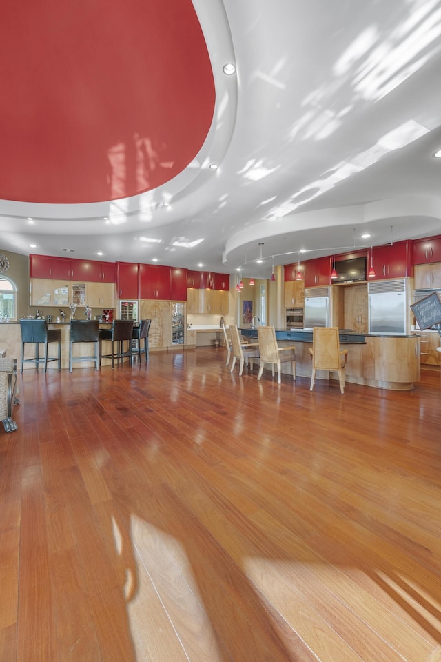 miscellaneous room featuring wood finished floors and recessed lighting