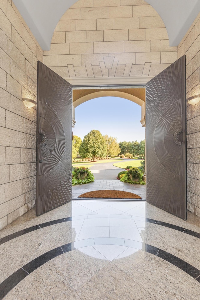 foyer featuring inlaid floor details