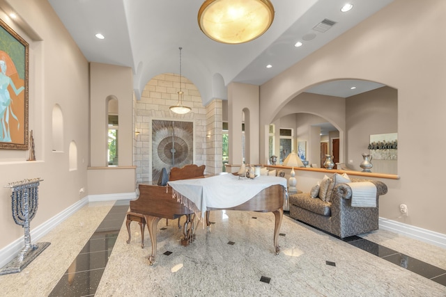 dining room with granite tiled floors, baseboards, recessed lighting, and inlaid floor details