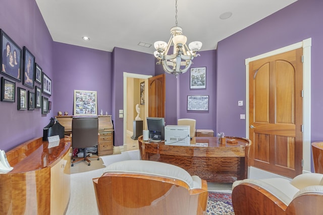 office area with a chandelier