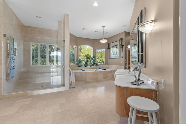 bathroom featuring a bath, a shower stall, vanity, tile patterned floors, and recessed lighting