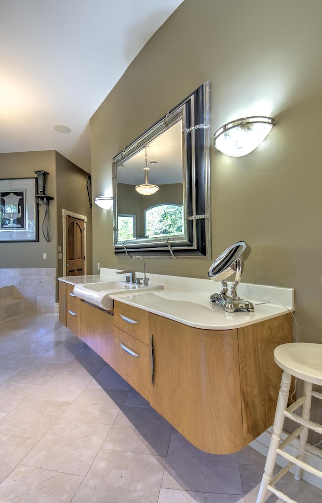 full bath featuring vanity and tile patterned flooring