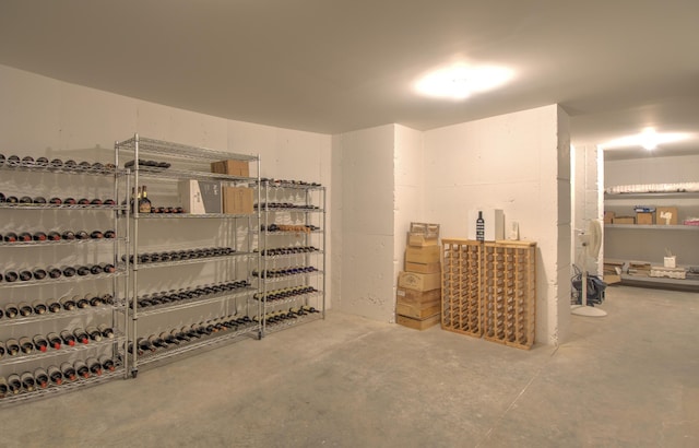 wine cellar featuring unfinished concrete flooring