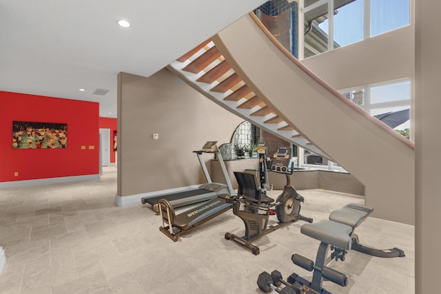 exercise room featuring recessed lighting and baseboards