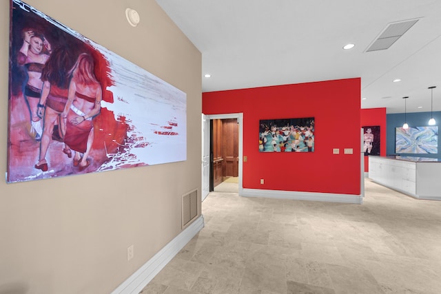 corridor featuring recessed lighting and baseboards