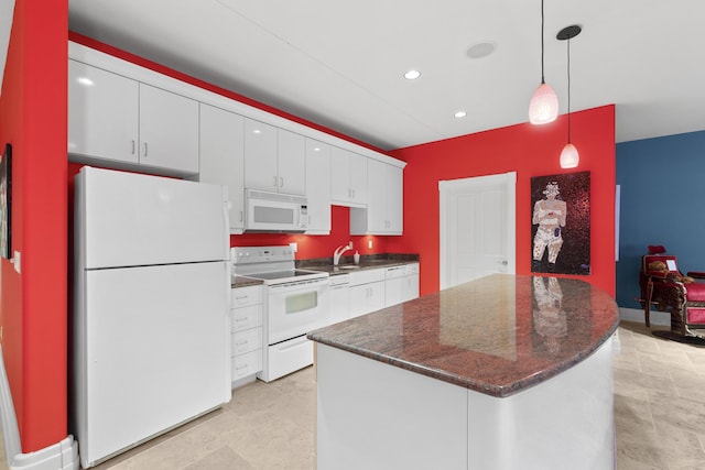 kitchen featuring white appliances, white cabinets, pendant lighting, a kitchen island, and recessed lighting