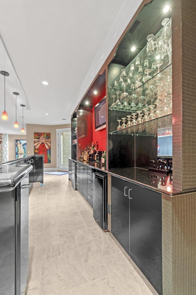 indoor wet bar featuring dishwasher, hanging light fixtures, and recessed lighting