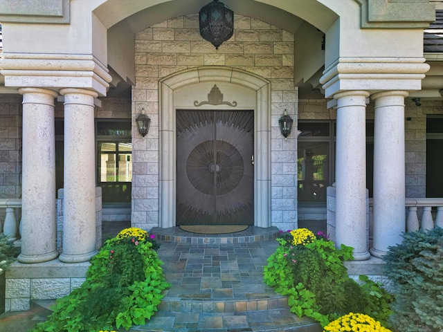 property entrance featuring stone siding