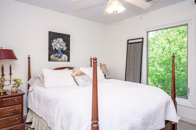 bedroom with ceiling fan and wood finished floors