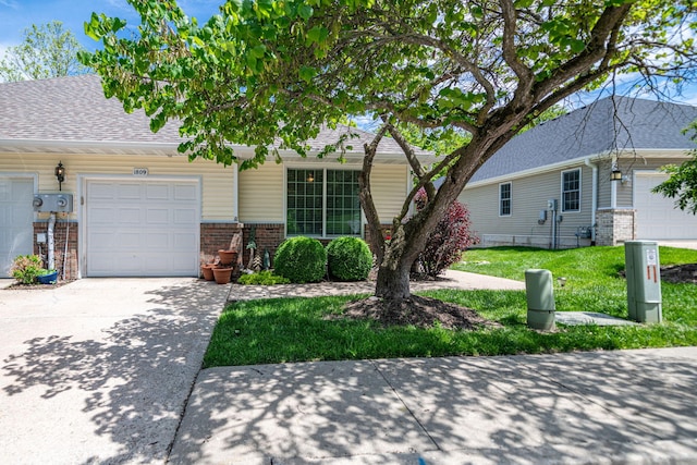multi unit property featuring brick siding, an attached garage, driveway, roof with shingles, and a front lawn