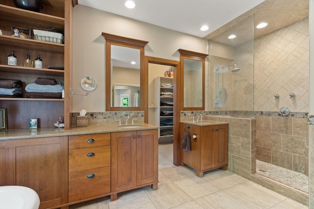 4700 E Deer Noll Rd, Columbia, MO 65201 - full bath with a walk in shower, vanity, tile patterned flooring, recessed lighting, and a spacious closet