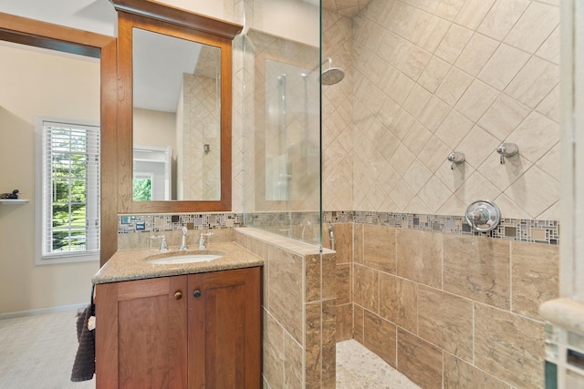 4700 E Deer Noll Rd, Columbia, MO 65201 - bathroom featuring vanity, walk in shower, and baseboards