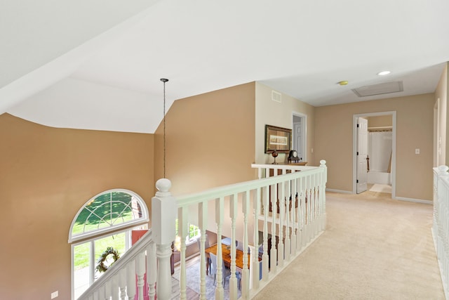 4700 E Deer Noll Rd, Columbia, MO 65201 - hallway with an upstairs landing, light carpet, and baseboards