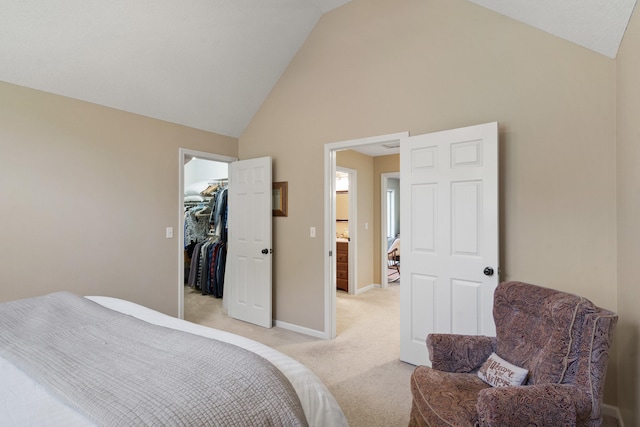 4700 E Deer Noll Rd, Columbia, MO 65201 - bedroom featuring light colored carpet, high vaulted ceiling, a spacious closet, and baseboards