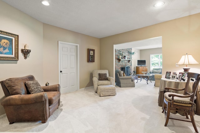 4700 E Deer Noll Rd, Columbia, MO 65201 - carpeted living room with recessed lighting and a fireplace