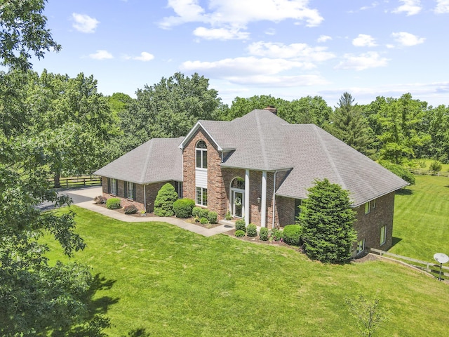 4700 E Deer Noll Rd, Columbia, MO 65201 - view of front of house featuring brick siding, a chimney, and a shingled roof