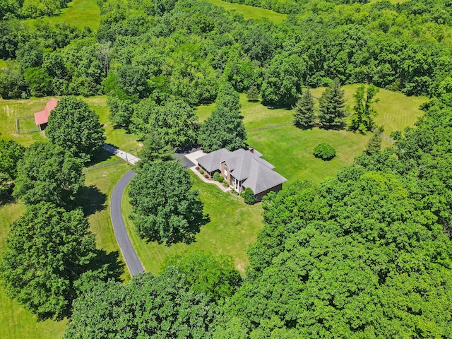 4700 E Deer Noll Rd, Columbia, MO 65201 - aerial view of property and surrounding area with a heavily wooded area