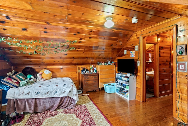bedroom with wood-type flooring, wood walls, lofted ceiling, and wood ceiling