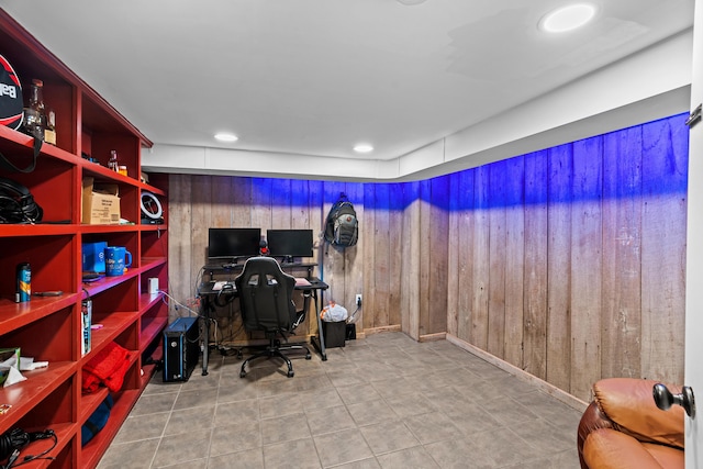 office area with wood walls and recessed lighting