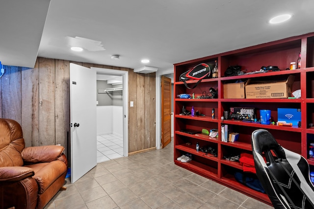 office featuring wooden walls and tile patterned flooring