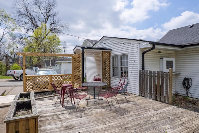 wooden terrace featuring outdoor dining area