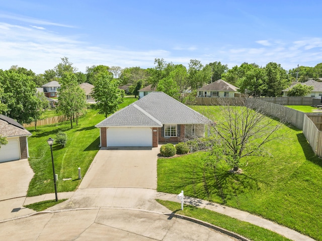ranch-style house featuring brick siding, driveway, and a garage