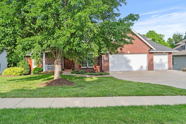 view of property hidden behind natural elements featuring an attached garage, driveway, brick siding, and a front yard