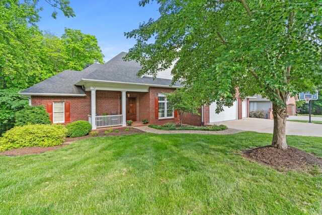 view of front of property with a porch, brick siding, concrete driveway, and a front yard