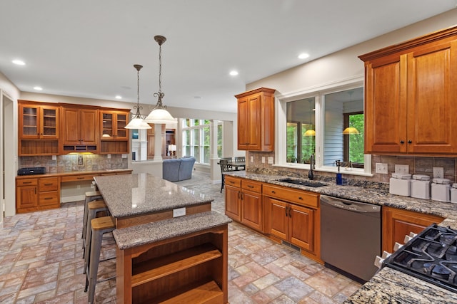 kitchen with dishwashing machine, a sink, open shelves, a kitchen island, and brown cabinets