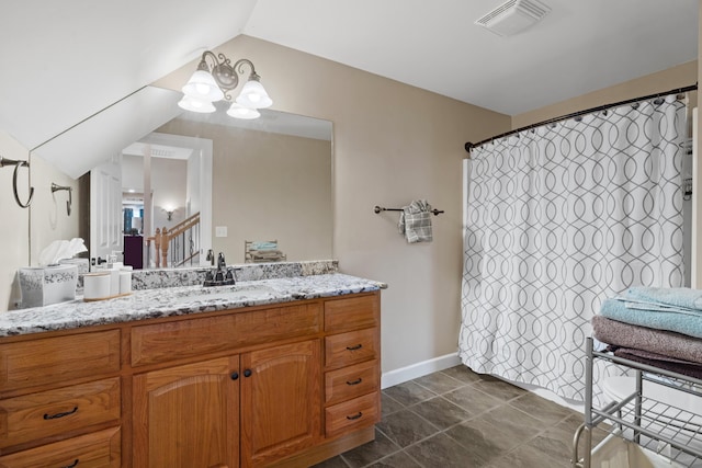 bathroom with a chandelier, vanity, a shower with curtain, and baseboards
