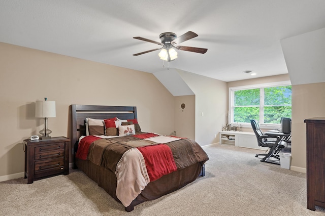 carpeted bedroom featuring an office area, baseboards, and a ceiling fan
