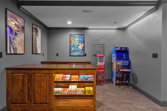 recreation room featuring ornamental molding, baseboards, and recessed lighting