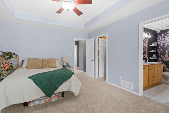 bedroom featuring light carpet, a raised ceiling, baseboards, and ceiling fan