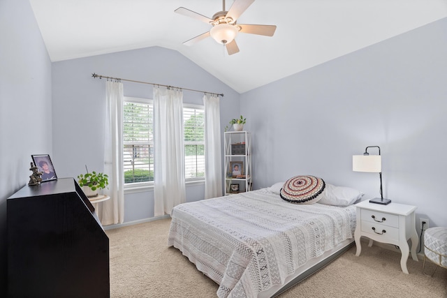 bedroom with light carpet, vaulted ceiling, ceiling fan, and baseboards
