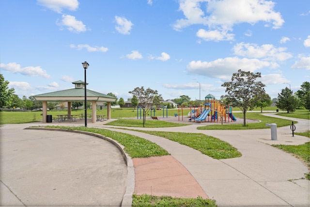 communal playground with a yard and a gazebo