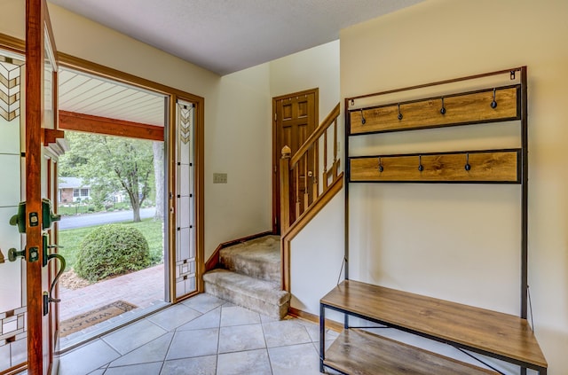 1209 Sunset Dr, Columbia, MO 65203 - entryway featuring french doors, stairway, and light tile patterned floors