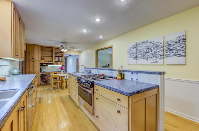 1209 Sunset Dr, Columbia, MO 65203 - kitchen with appliances with stainless steel finishes, light wood-type flooring, a ceiling fan, recessed lighting, and decorative backsplash
