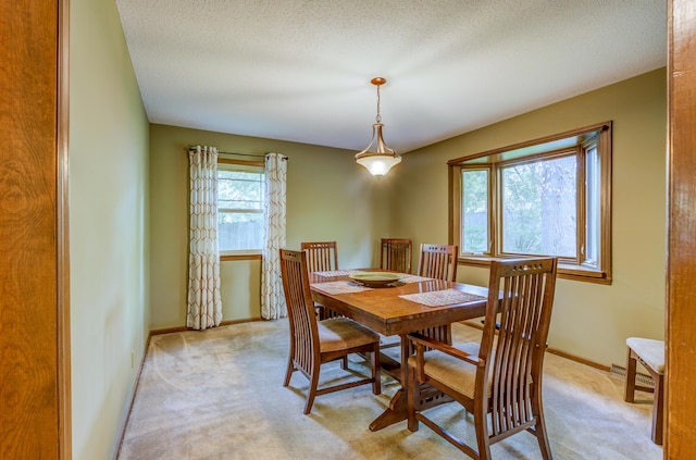1209 Sunset Dr, Columbia, MO 65203 - dining room featuring light colored carpet and baseboards