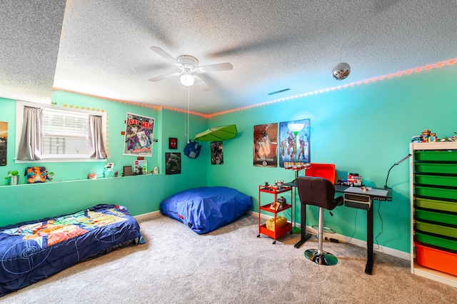 carpeted bedroom with a textured ceiling and ceiling fan