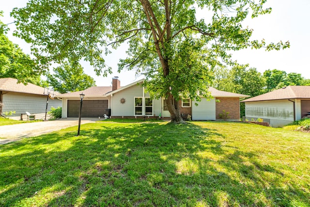 single story home featuring a garage, driveway, brick siding, a chimney, and a front yard